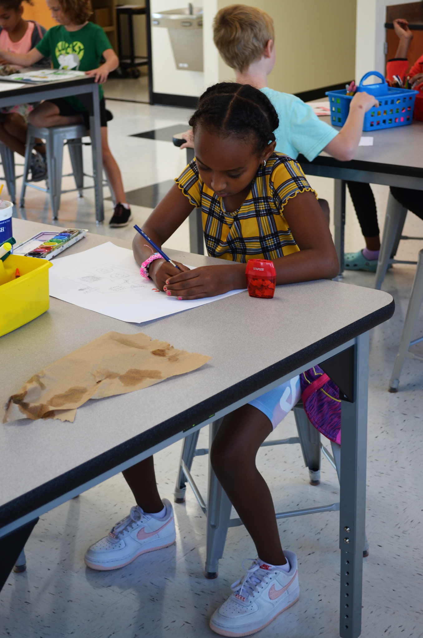 Student drawing in Maker Space