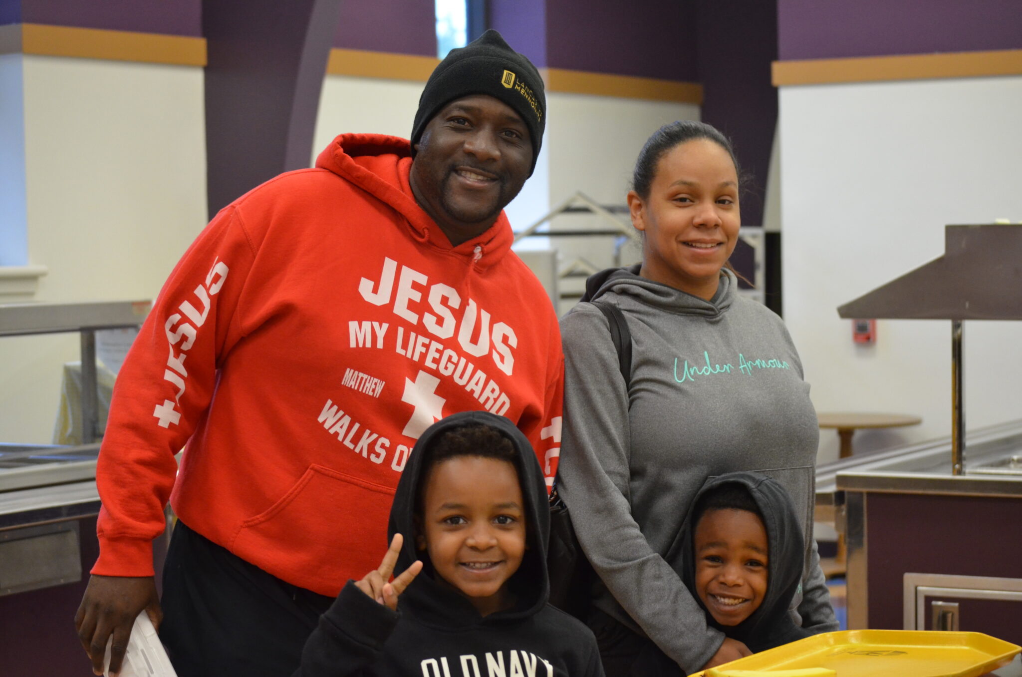 Family getting food in the cafeteria