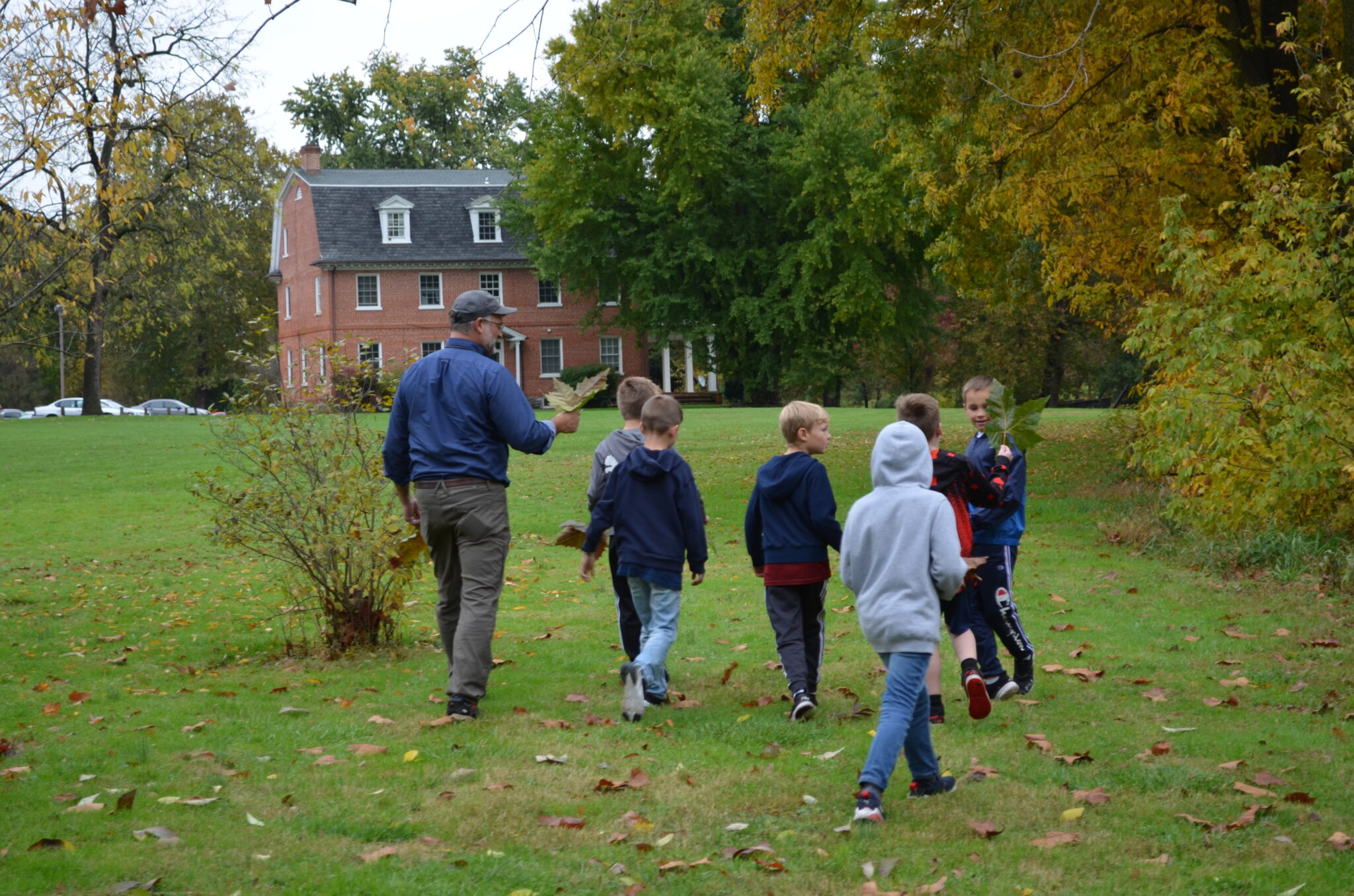 group of students on nature walk with Mr. Sauder