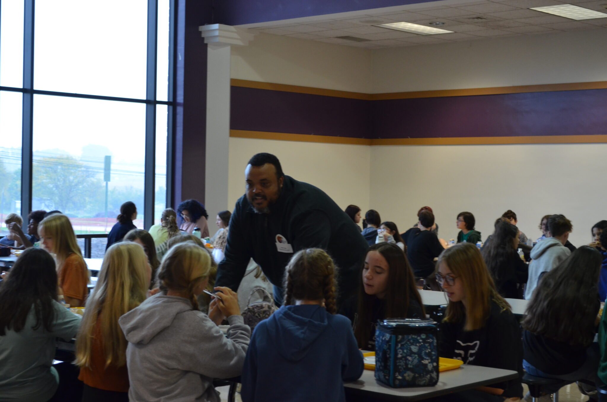 Pastor talking to group of students