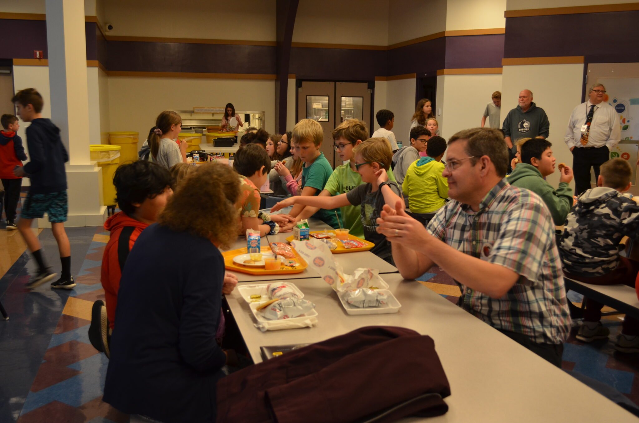 Two Pastors eating with their students