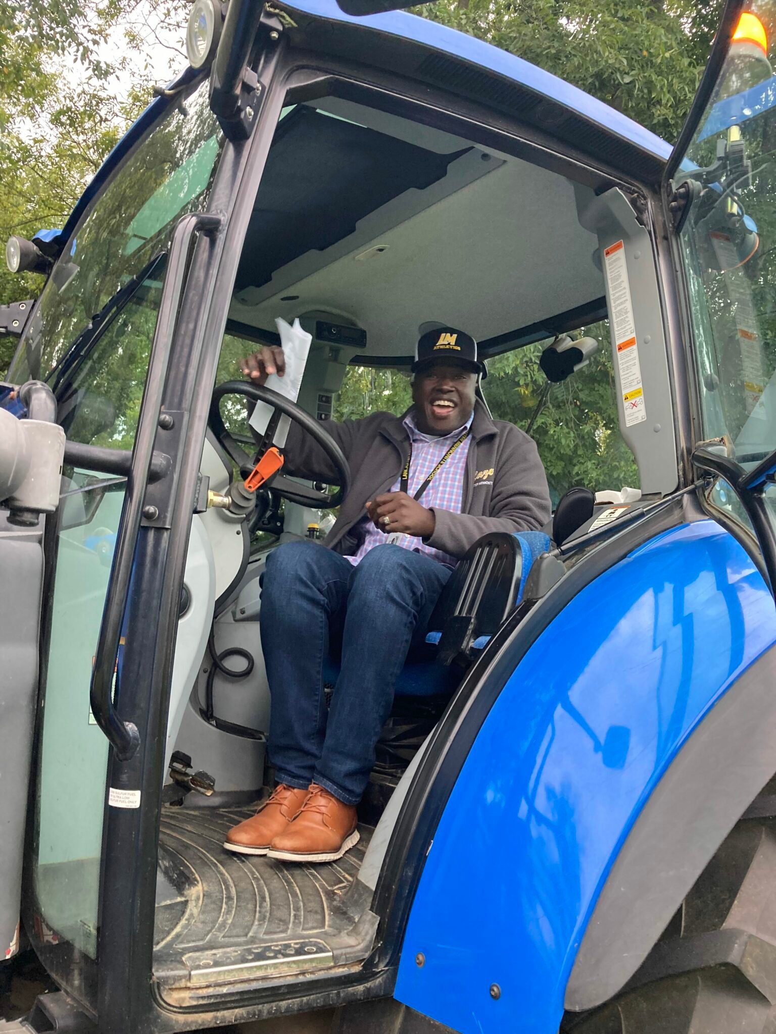 Dr. Badriaki in a tractor