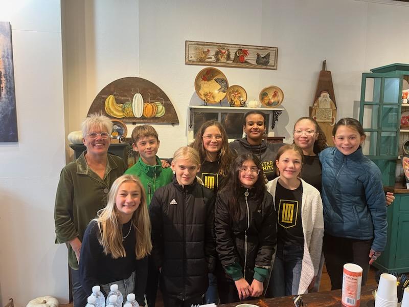 LM Middle School students and owner of Gallery on Market.