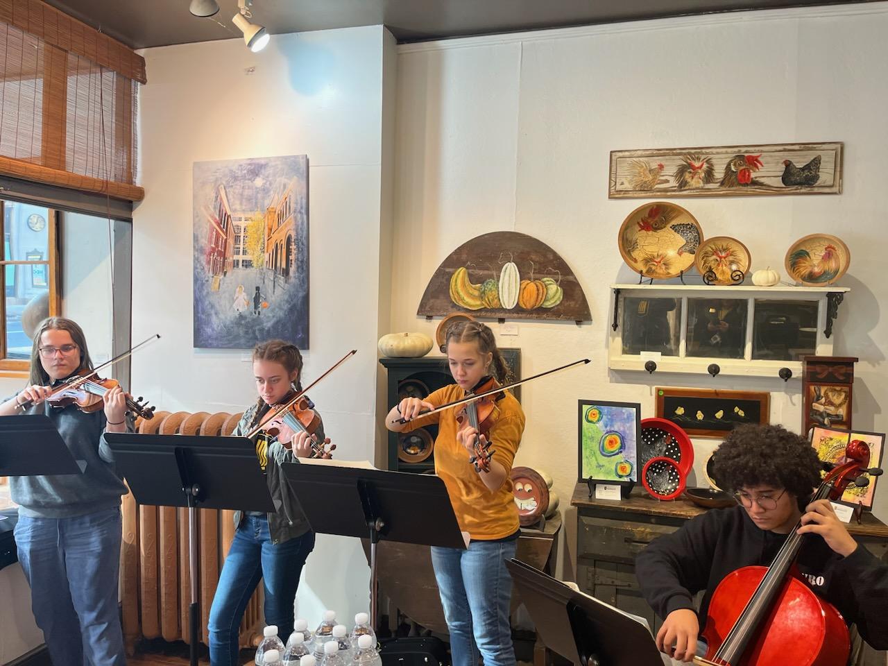 LM High school students playing instruments at Gallery on Market.