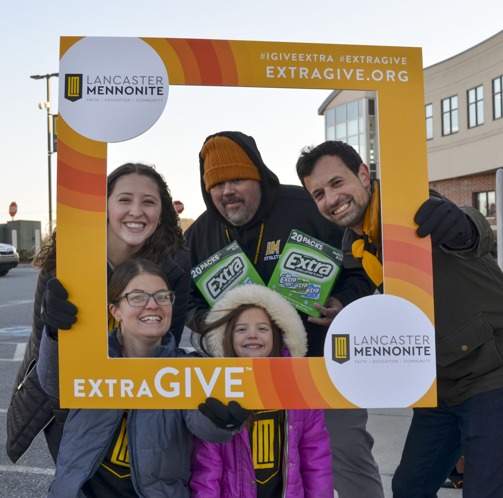 LM students and staff handing out gum during Extragive event