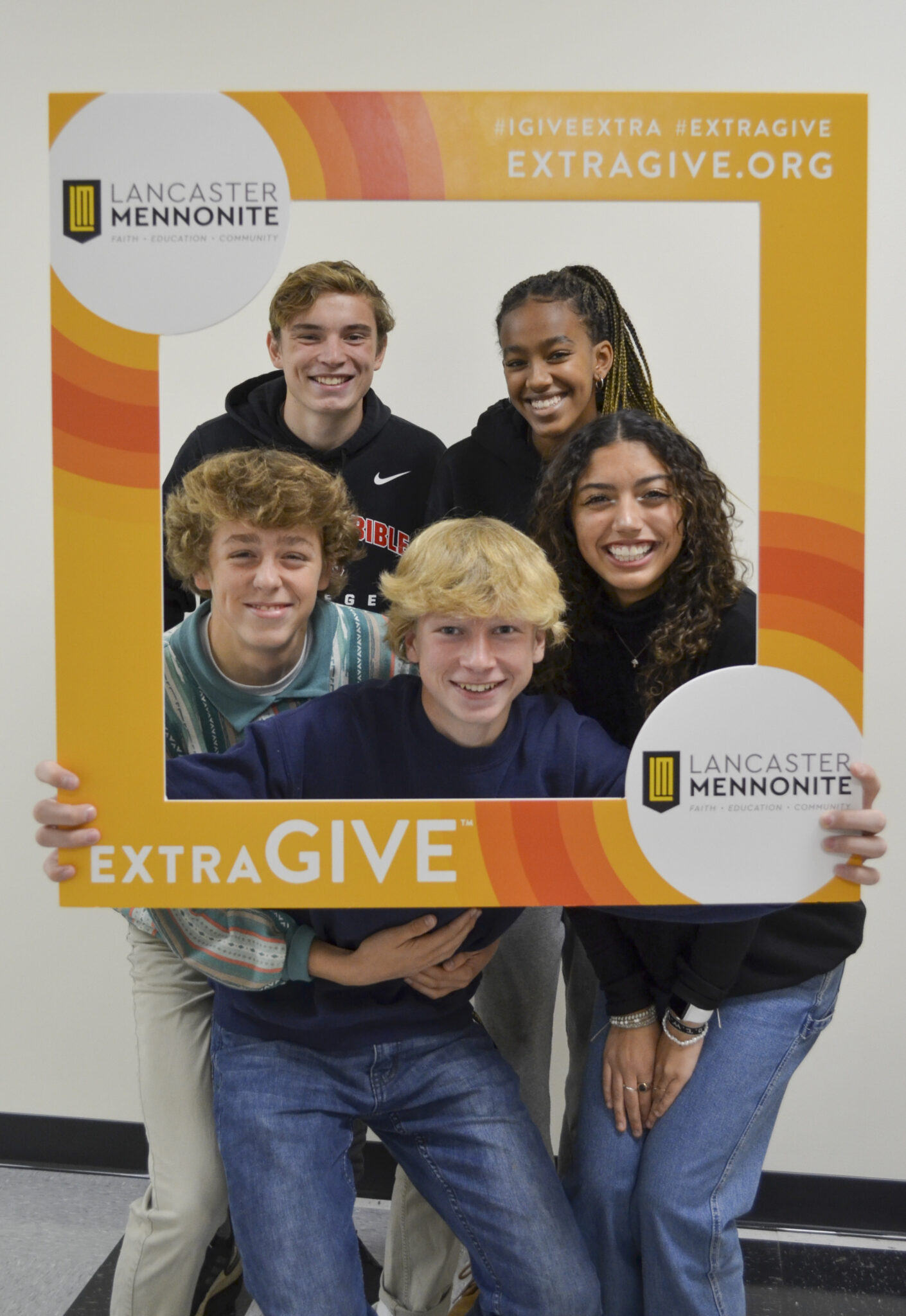 LM students in hallway with Extragive sign.