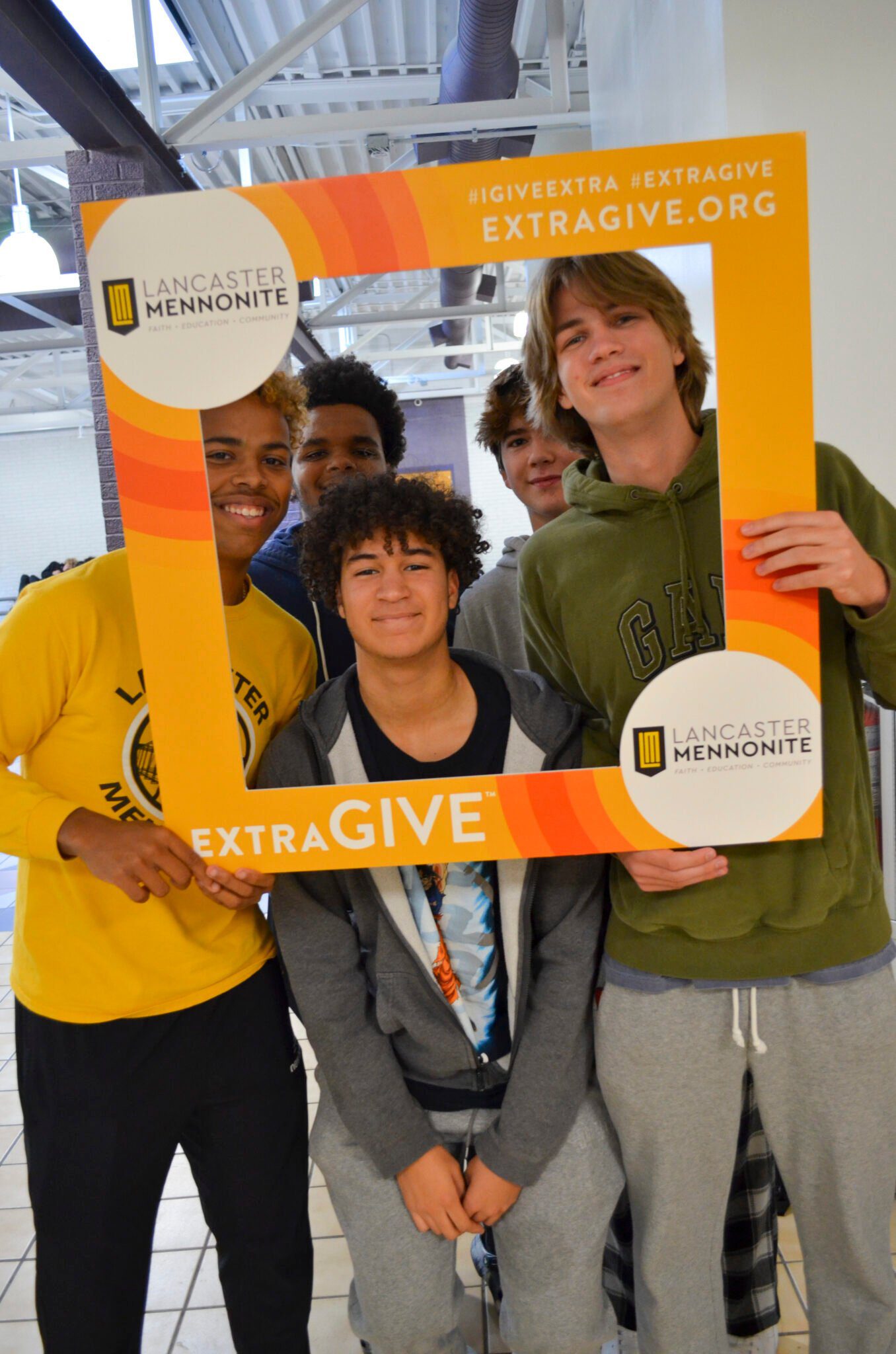 Students at lunch with ExtraGive sign