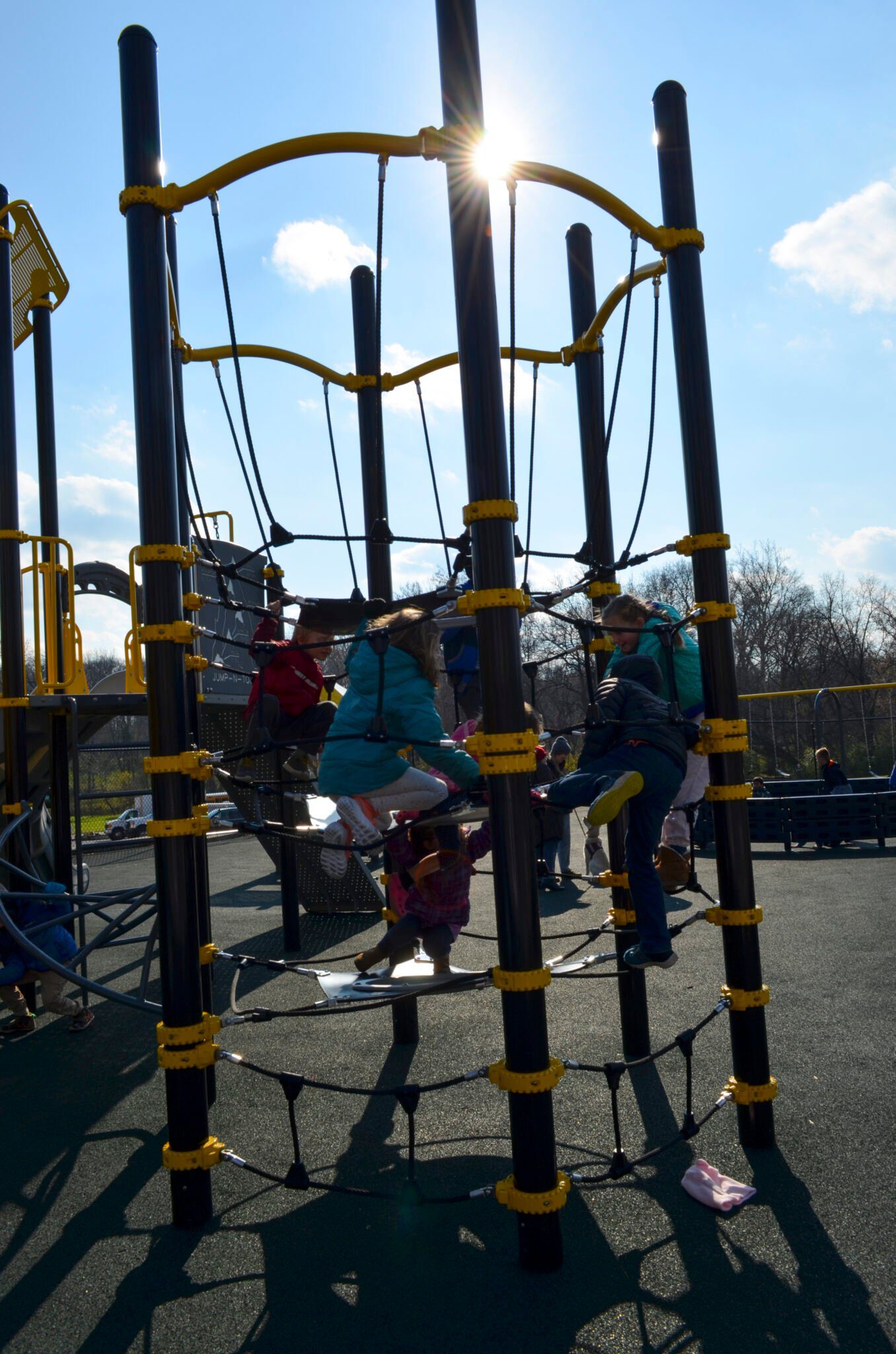 Elementary students climbing on the playground