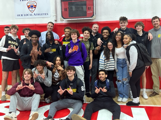 Students with the boys basketball team