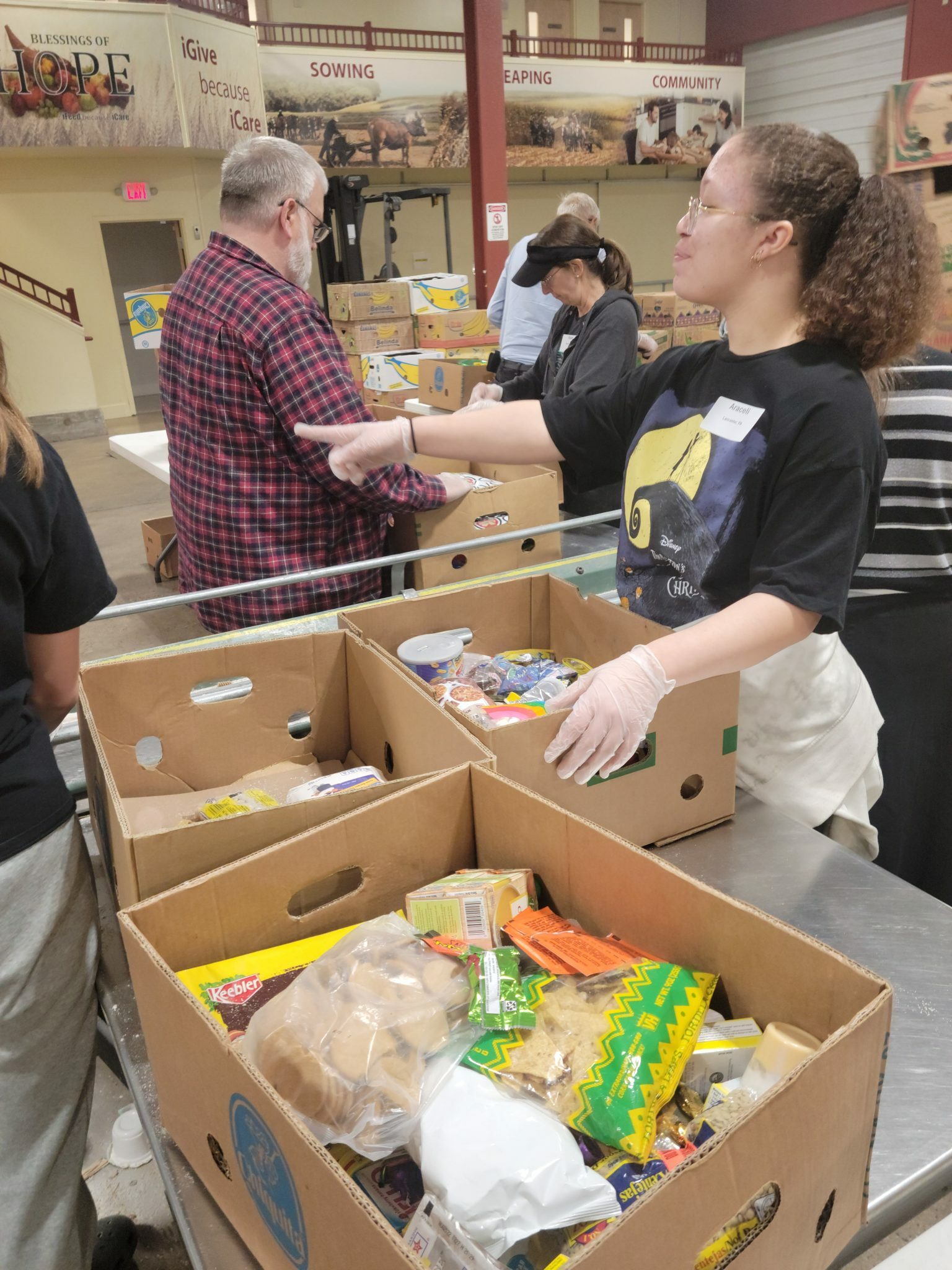 LM students putting together food boxes at Blessings of Hope