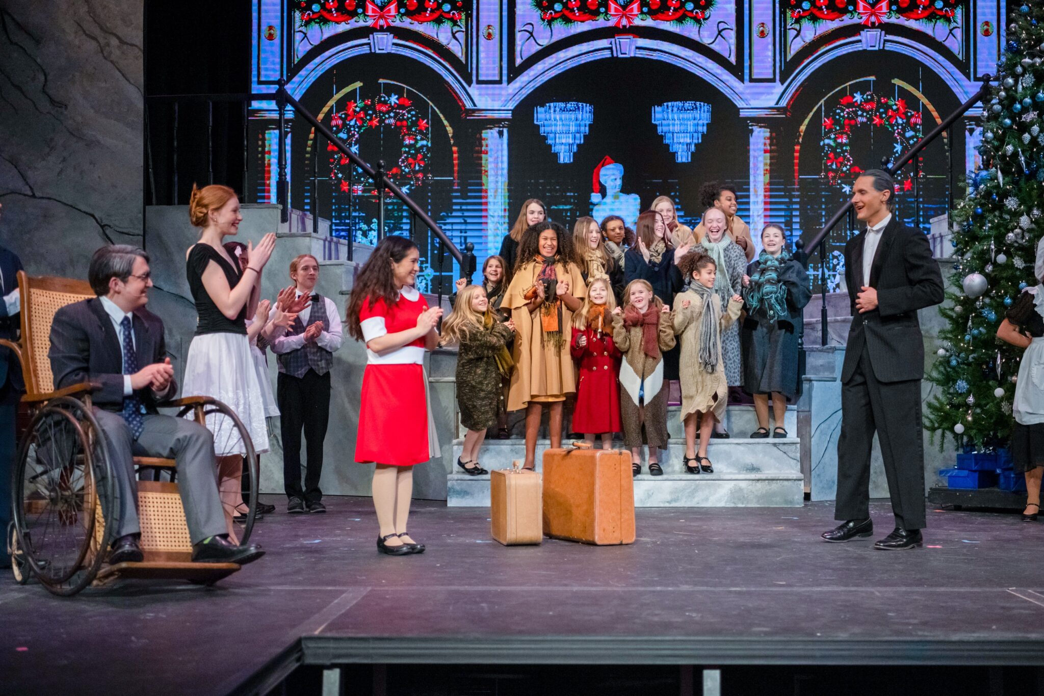 Cast of Annie on stage