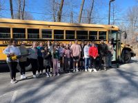 Students in front of bus during World Changer Week