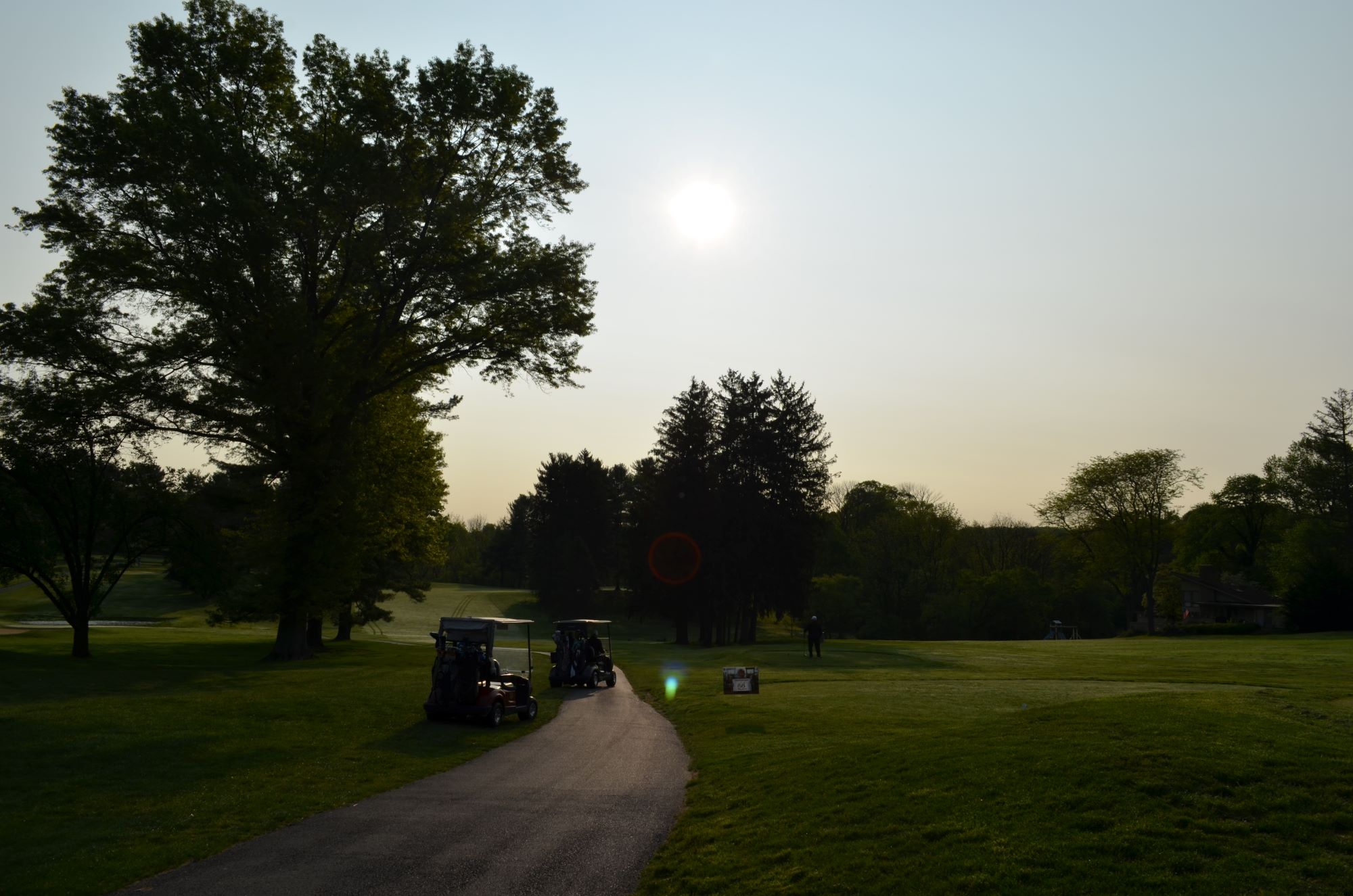 Two golf carts on the golf course.