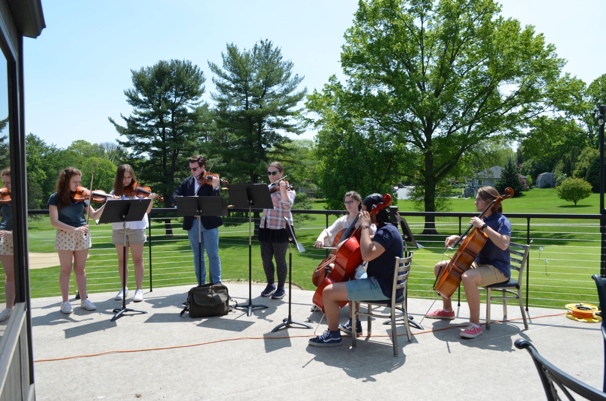 Orchestra students playing music during lunch.