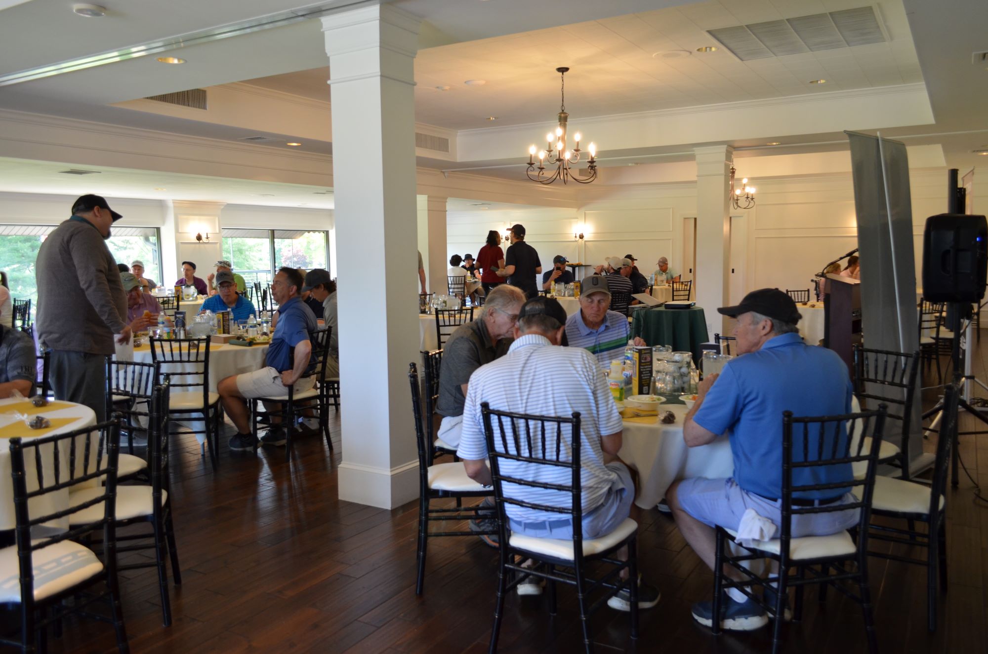 The morning round of golfers enjoying their lunch.