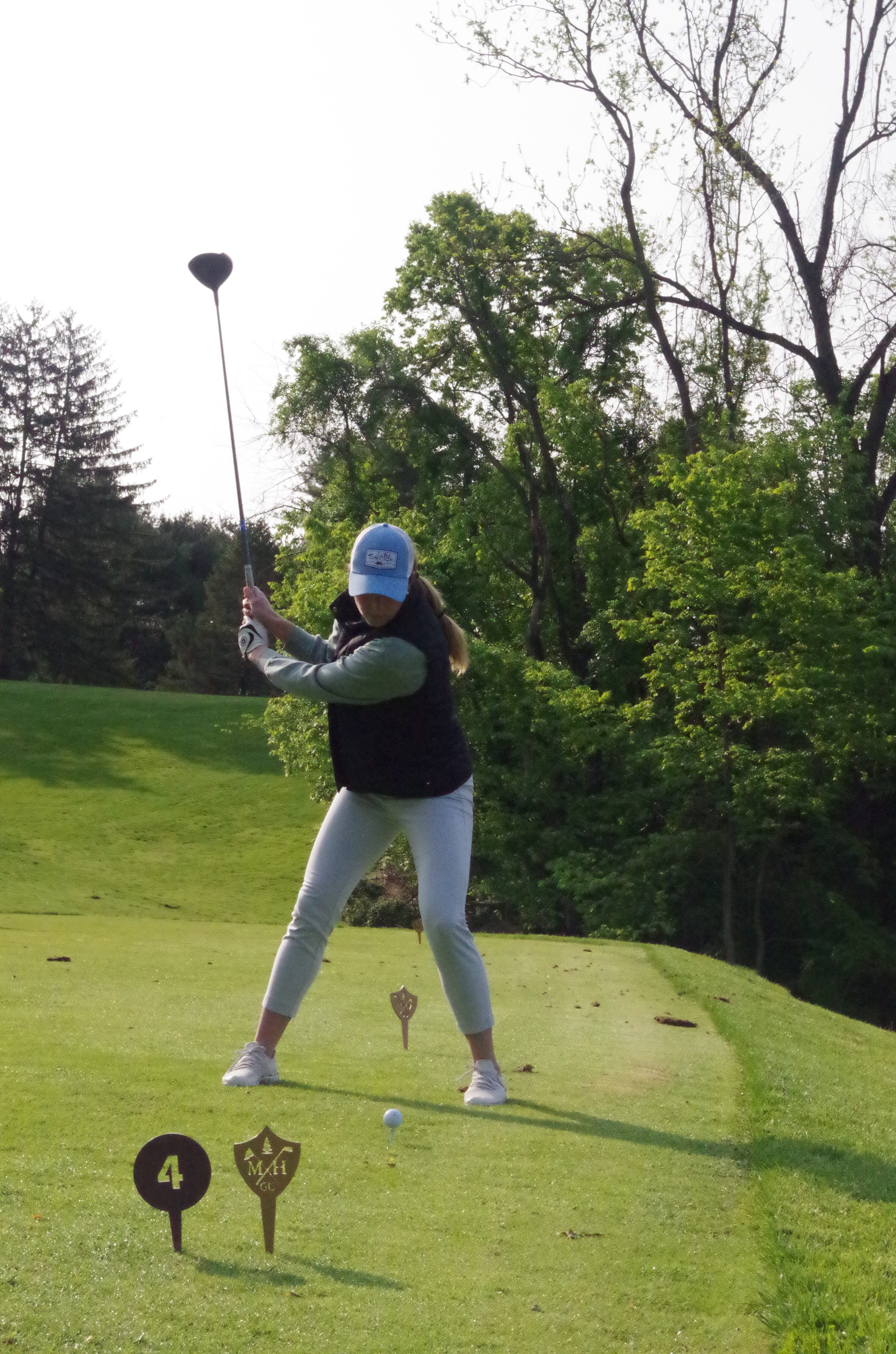 Golfer hitting the ball