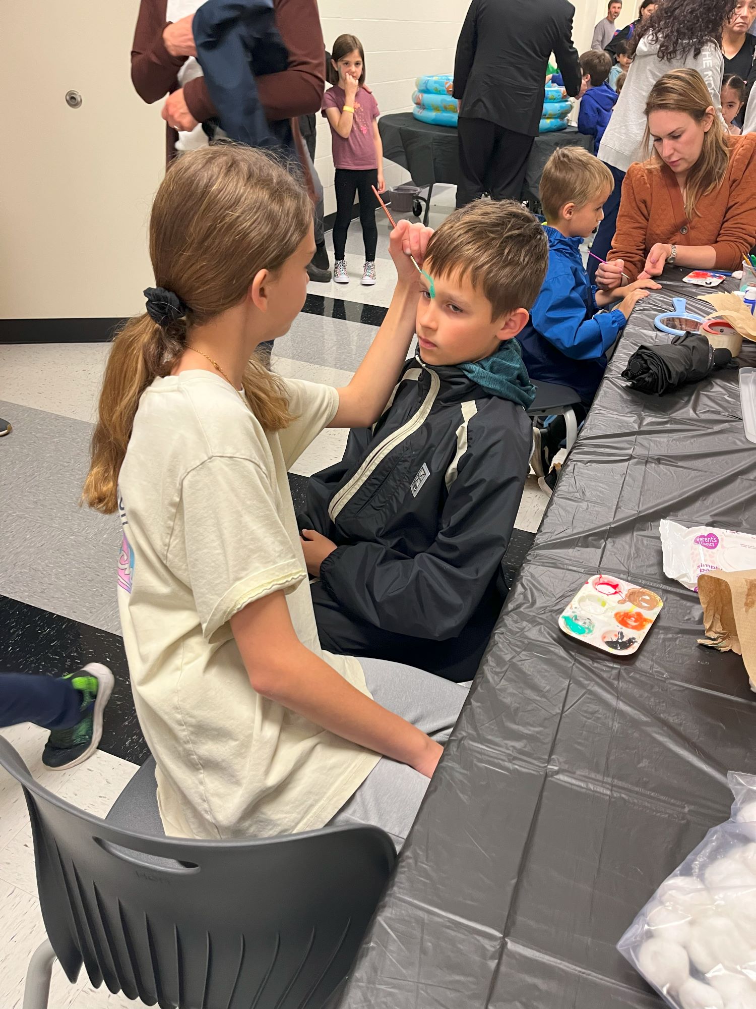 Students getting their faces painted