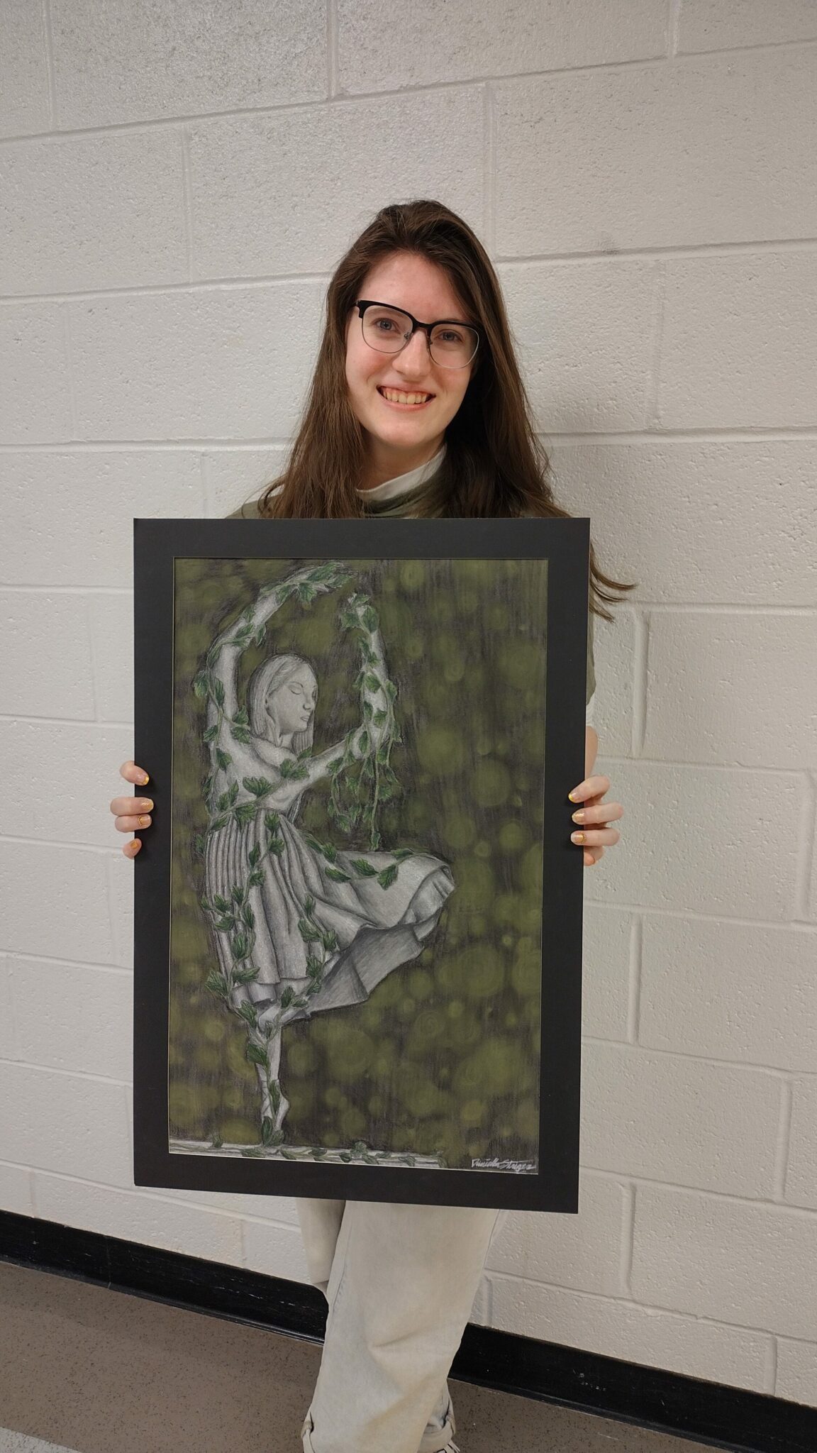 Daniella stringer with her conte pencil drawing.