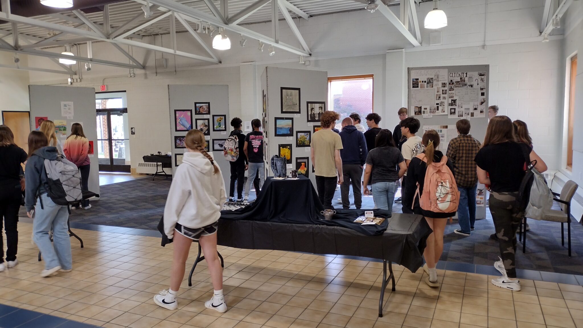 students looking at art display