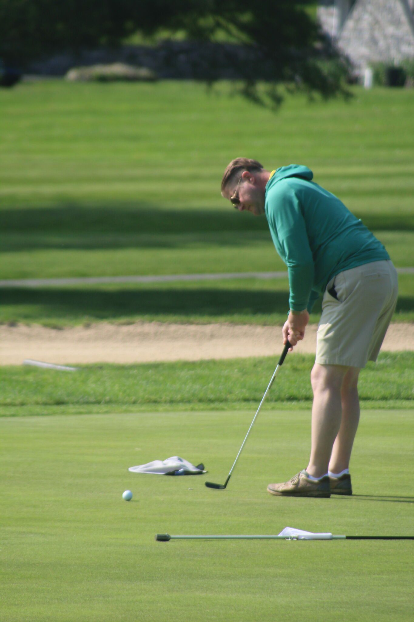 Golfer swinging his golf club.