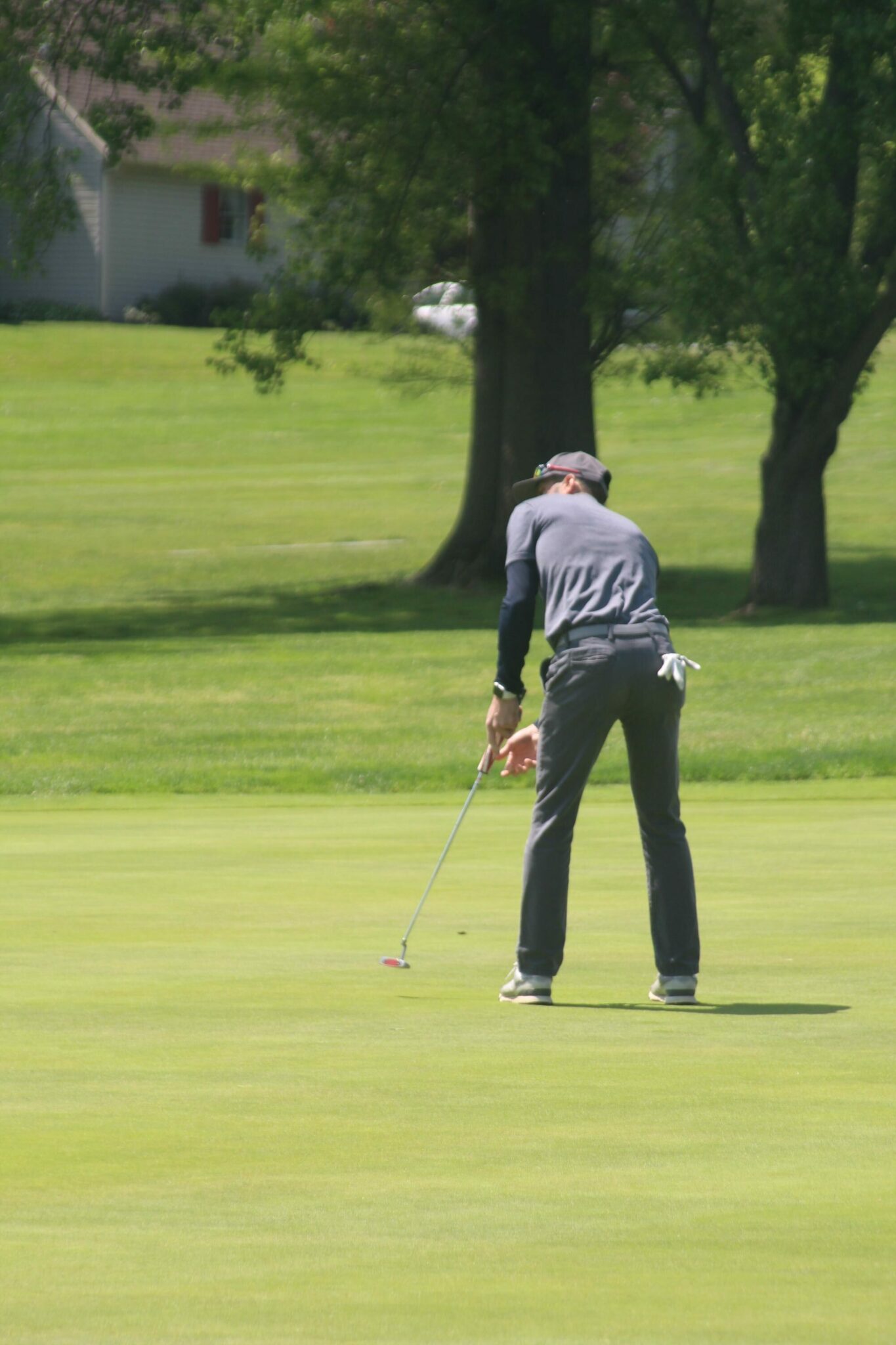 Golfer swinging the golf club