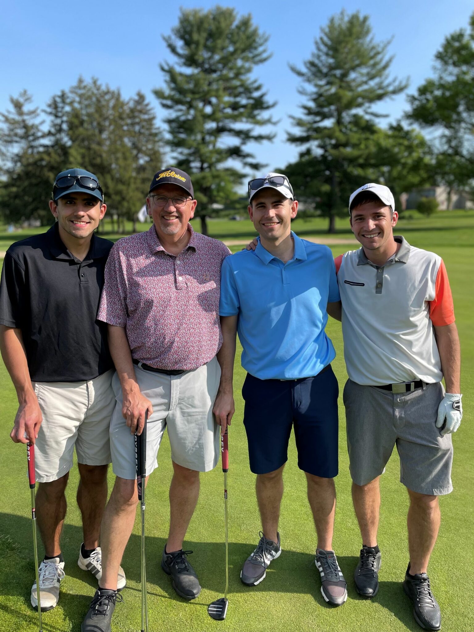 Four golf participants.