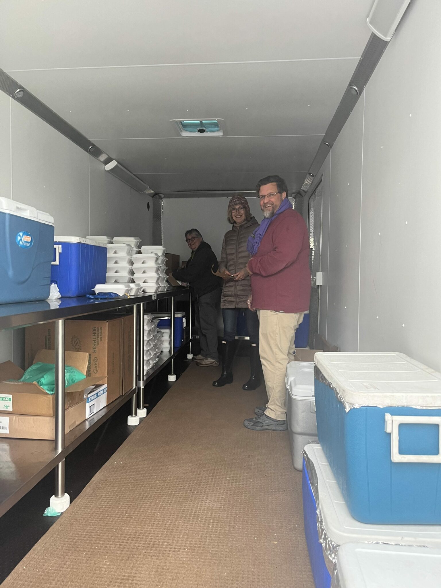 Volunteers in the BBQ trailer