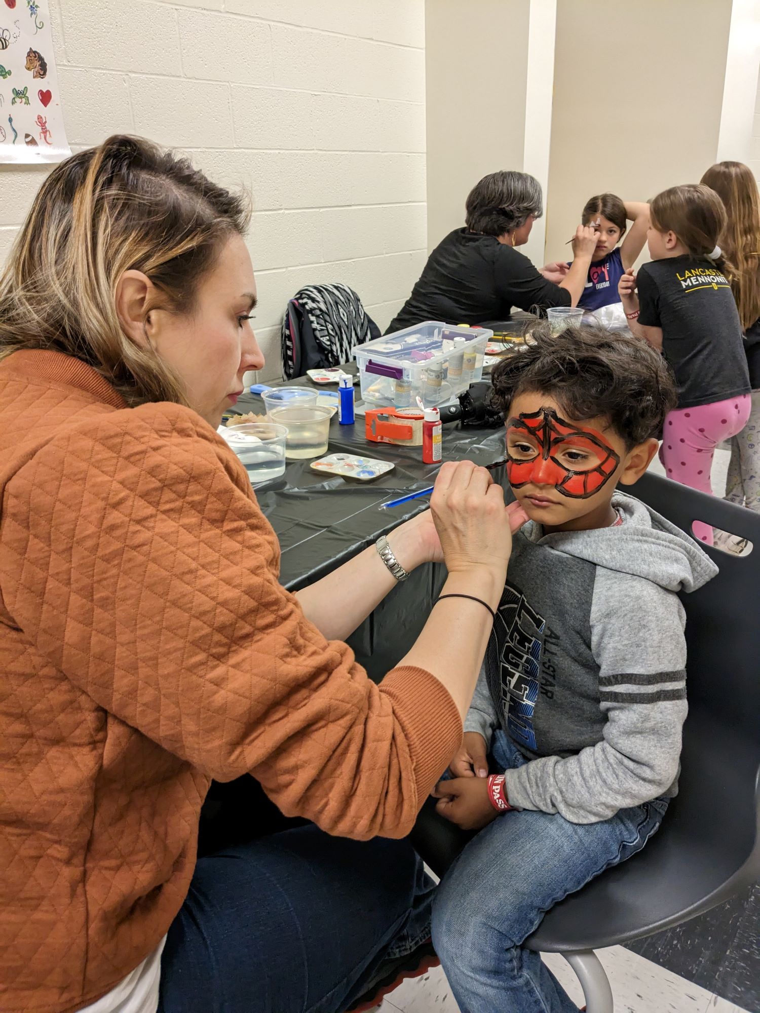 Students getting their face painted during the Spring Celebration