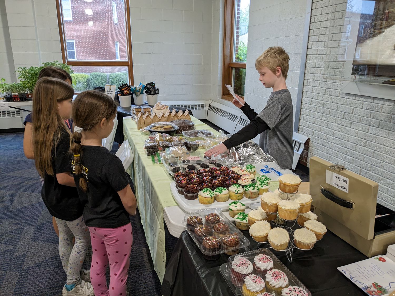 Students at the bake sale table.