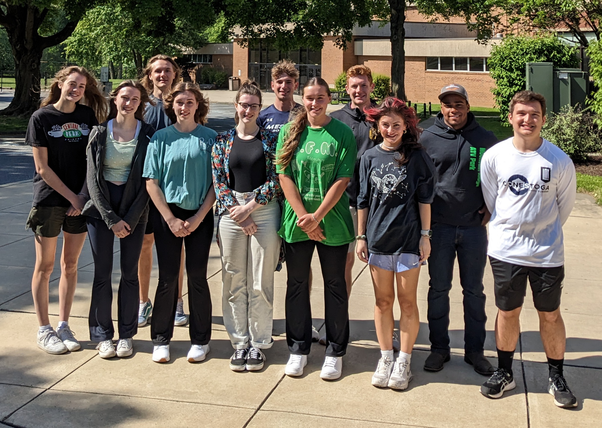 Seniors that won Department awards. Standing outside the school as a group.