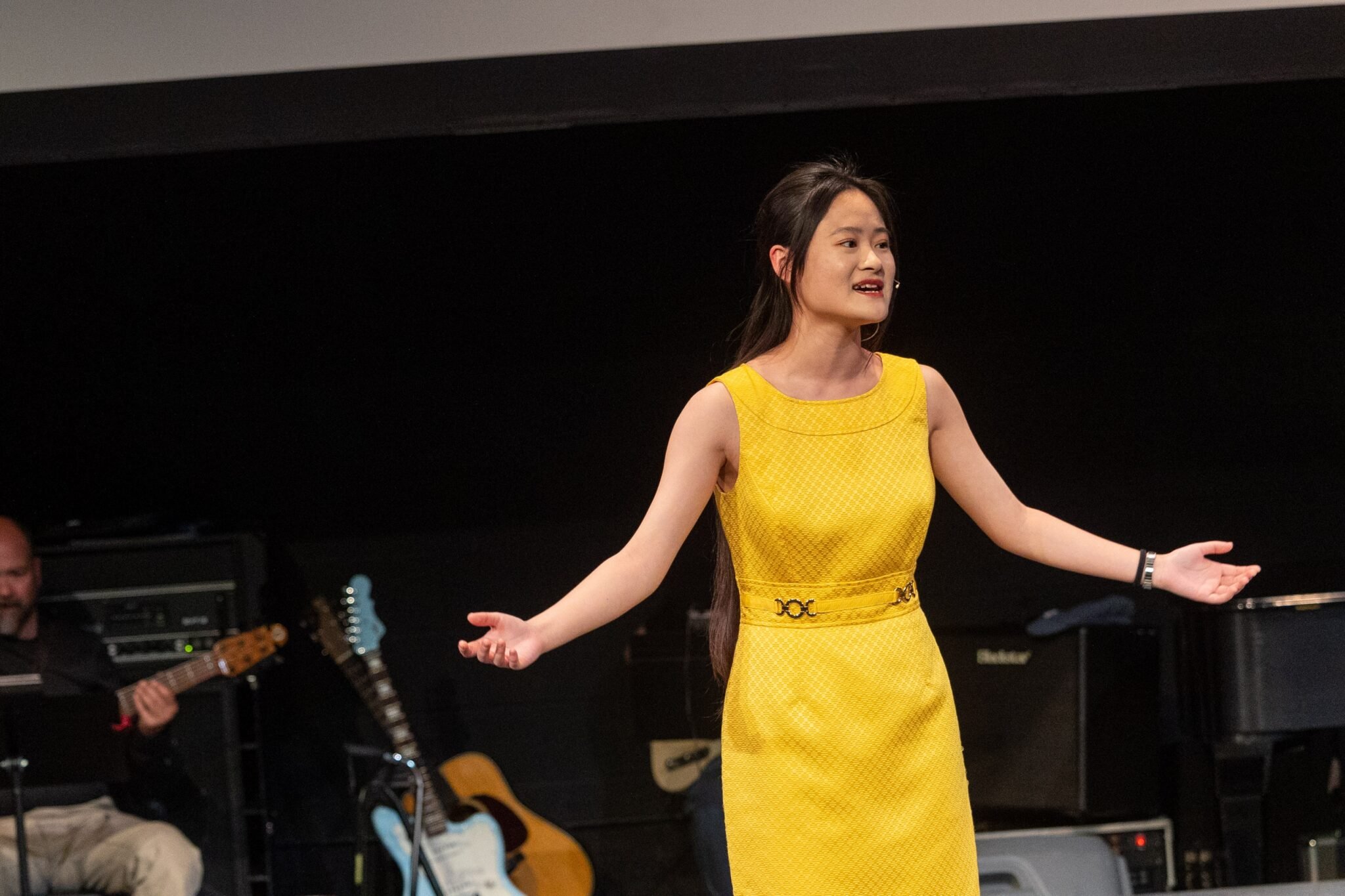 Student singing in production of 