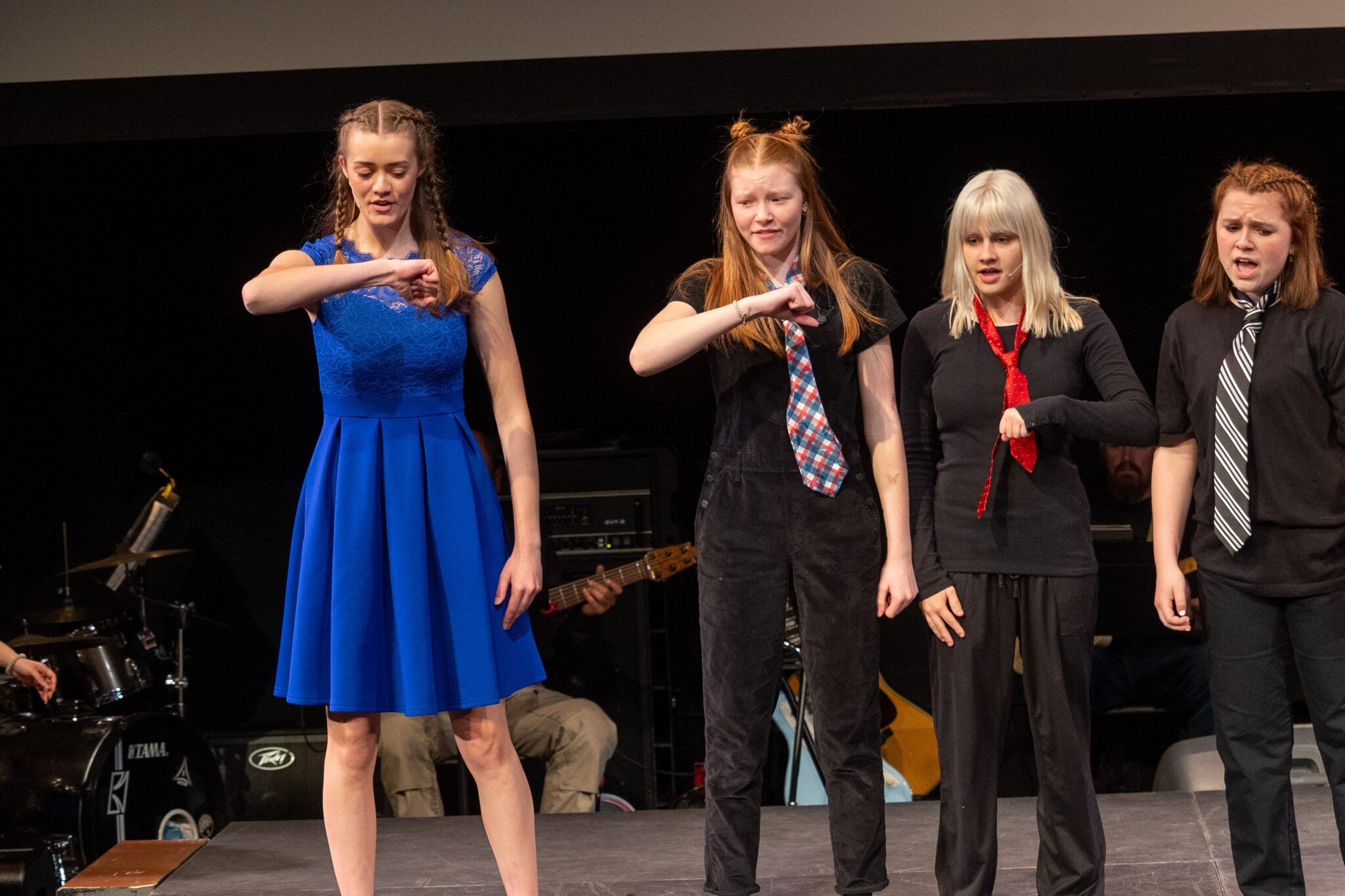 Students on stage in production of 