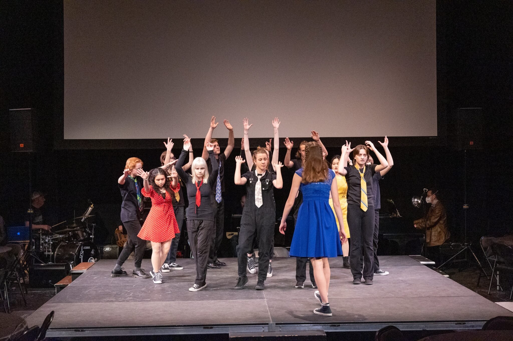 Students on stage during production of 