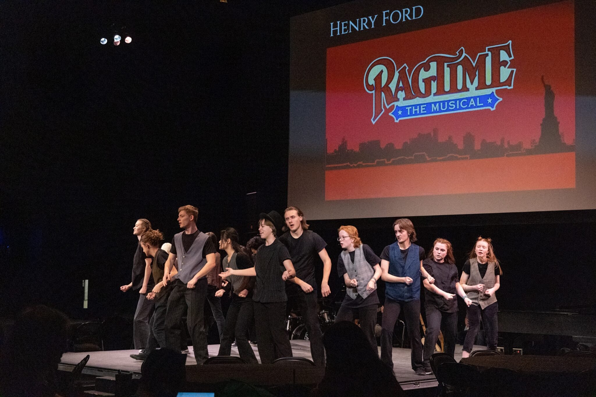 Students singing and dancing on stage