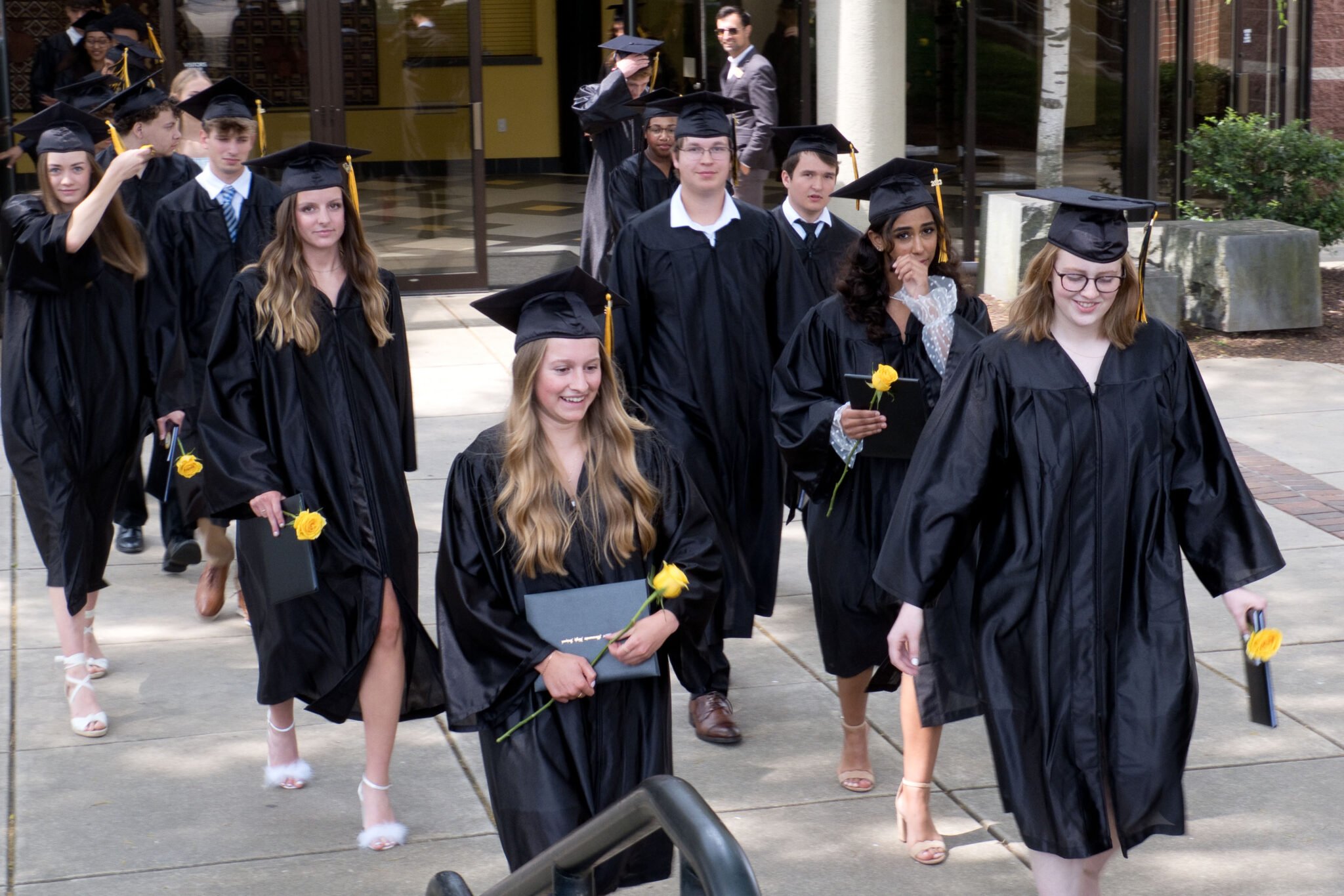 Students walking out of the FAC after Graduation