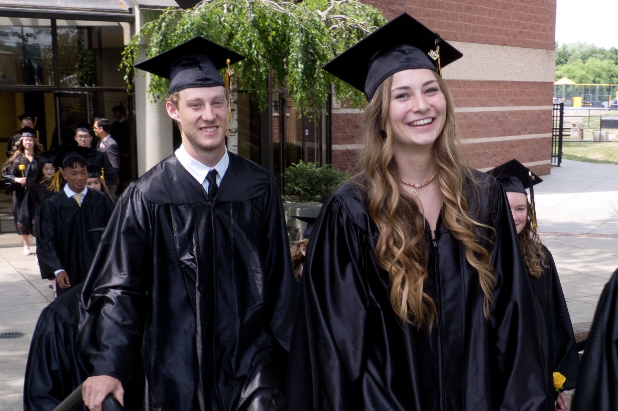 Students walking out of the FAC after Graduation