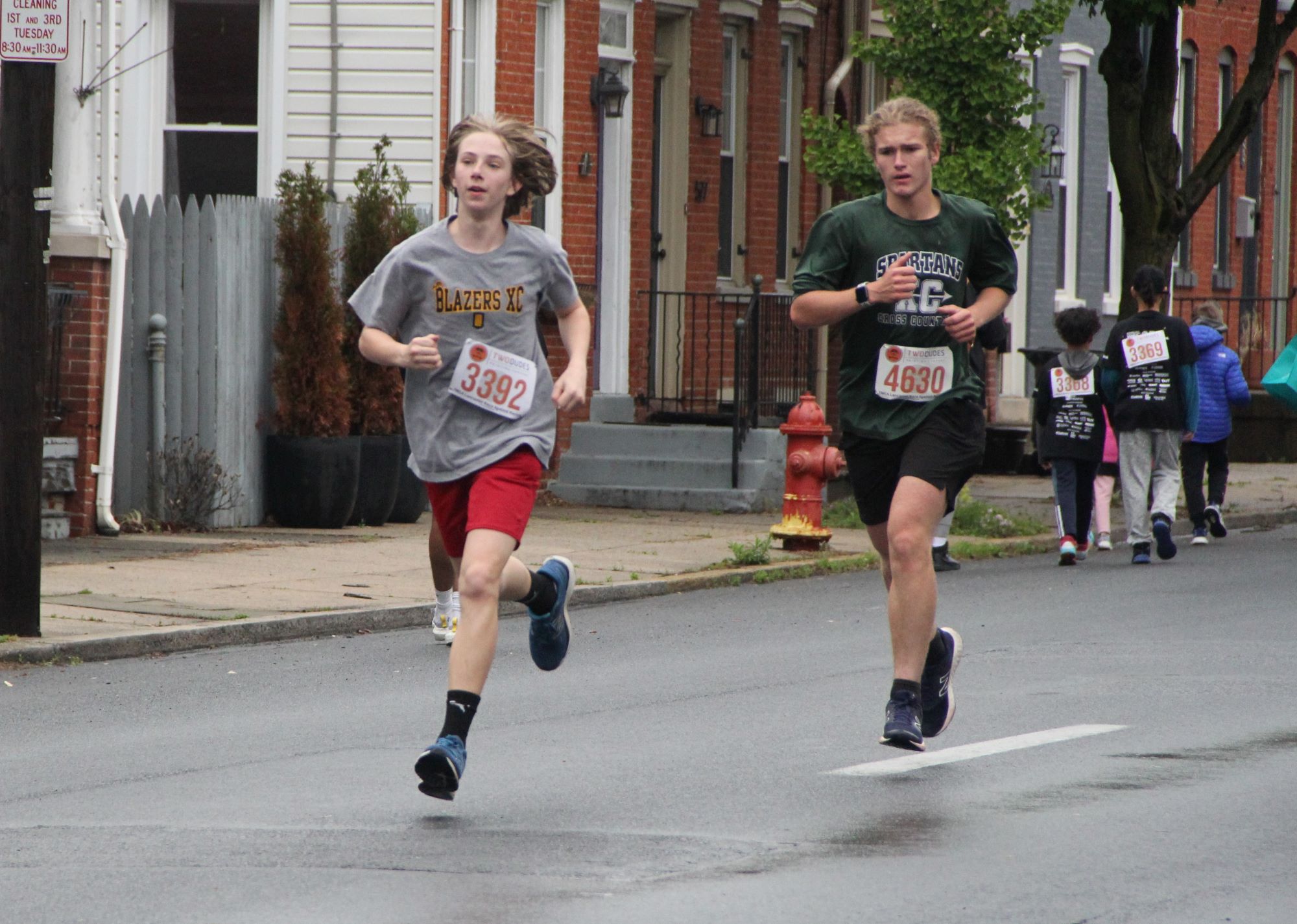 Two students running in Race Against Racism