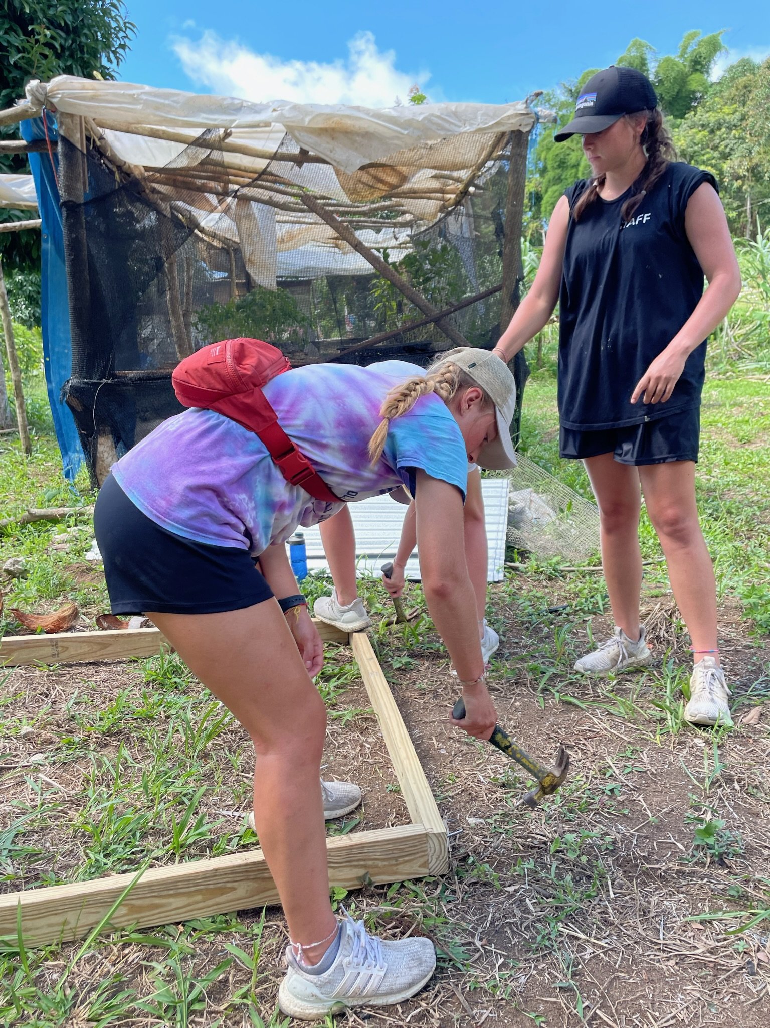 LM Varsity Girls Soccer Team in Jamaica helping to build