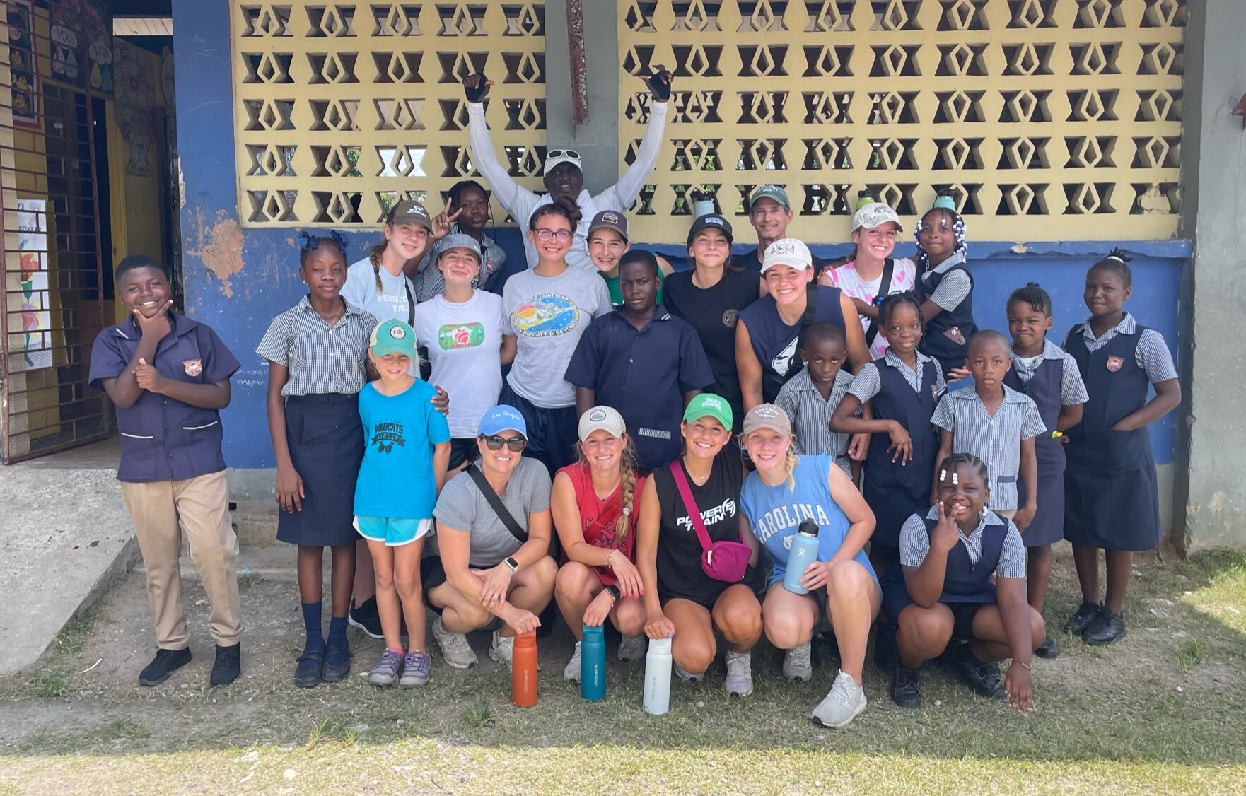 Girls soccer team with children in Jamaica