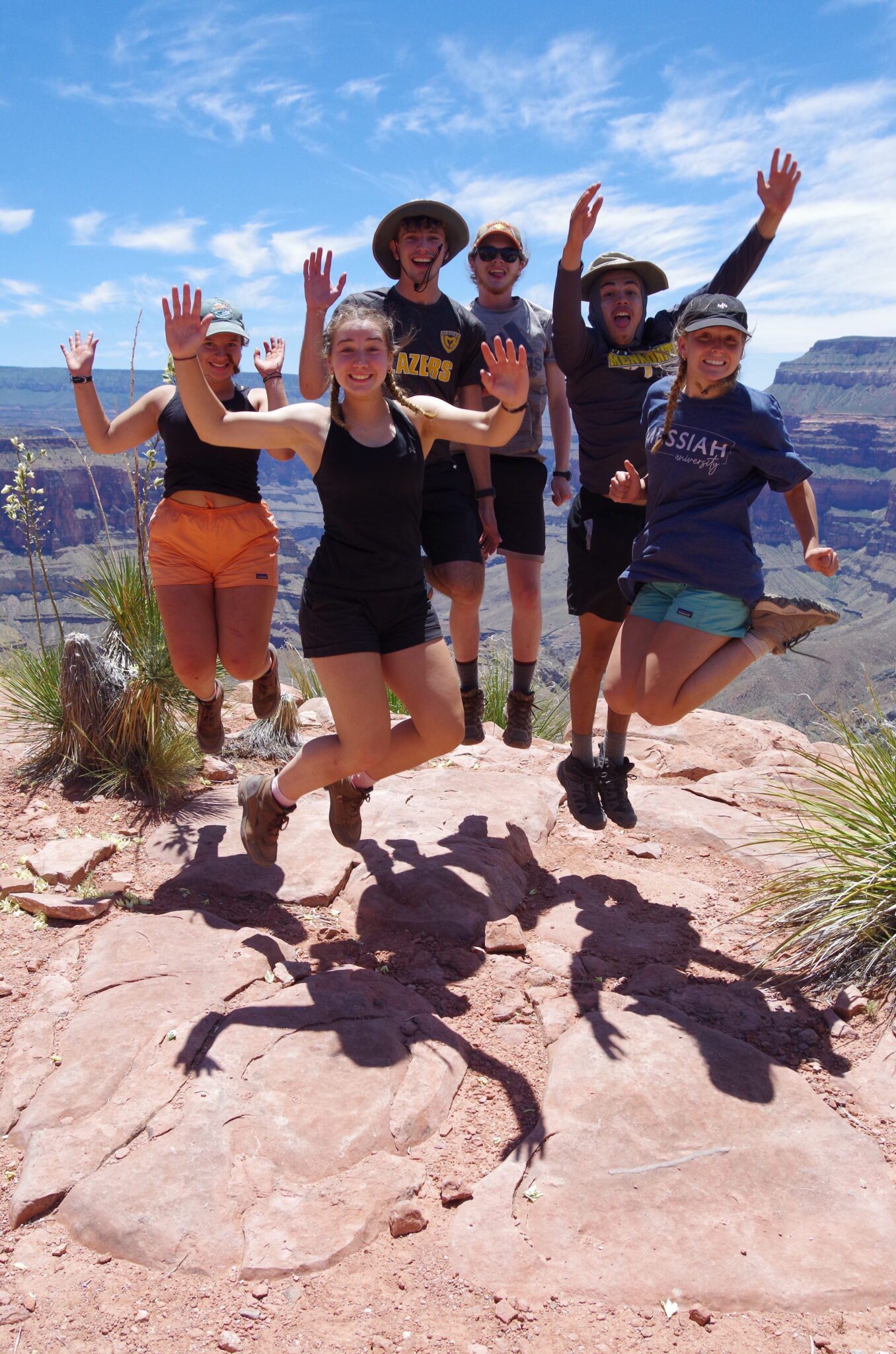 Students jumping at the Grand Canyon