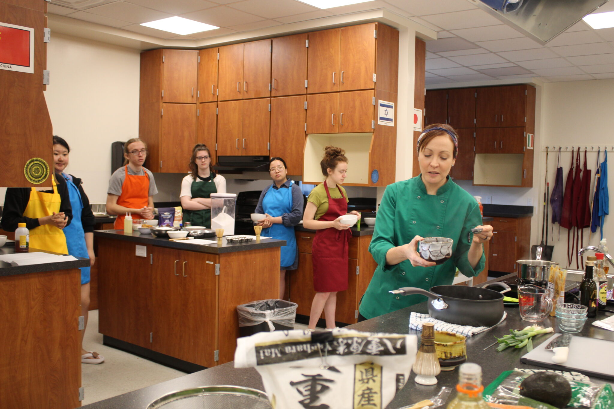 Students learning to cook Japanese cuisine