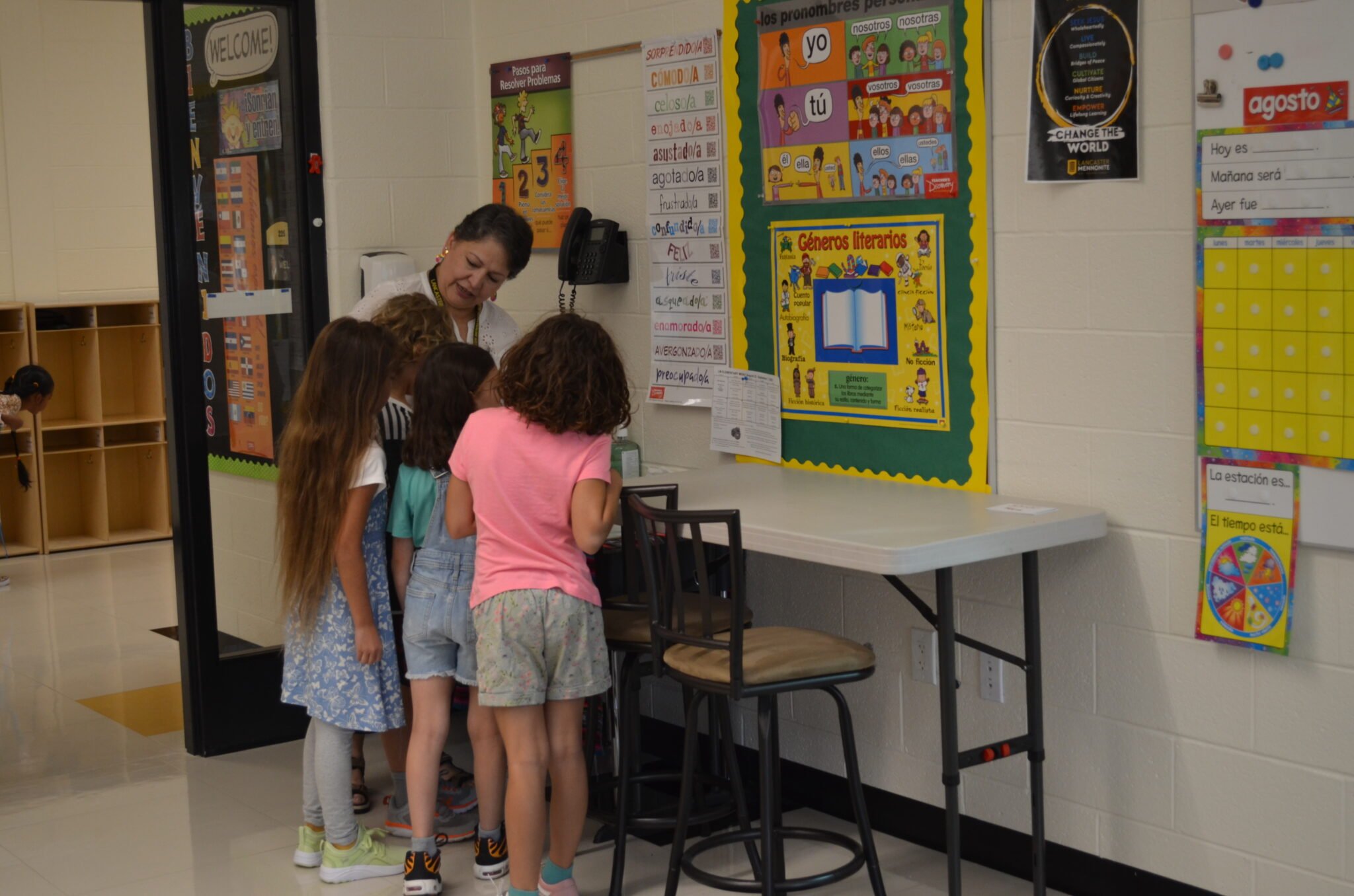 students talking to their teacher