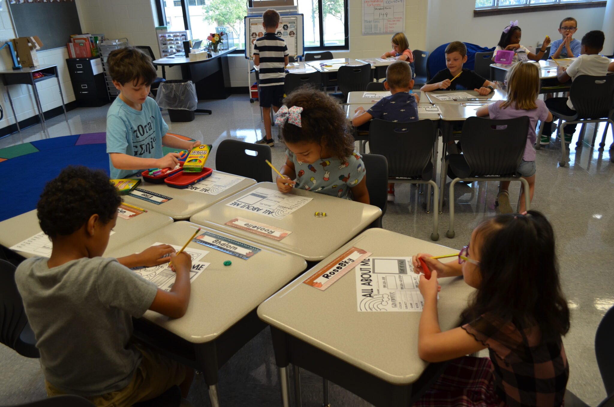 elementary students filling out questionnaire