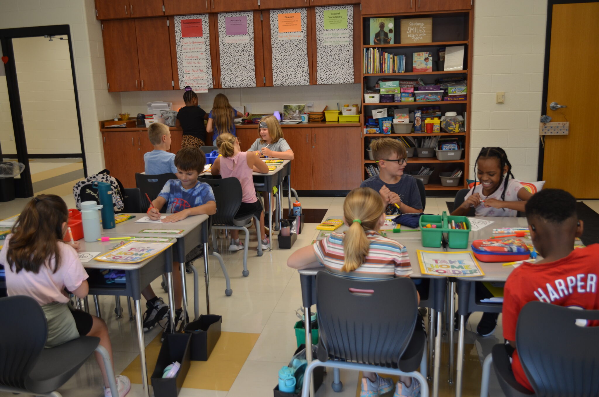 Elementary students coloring in class