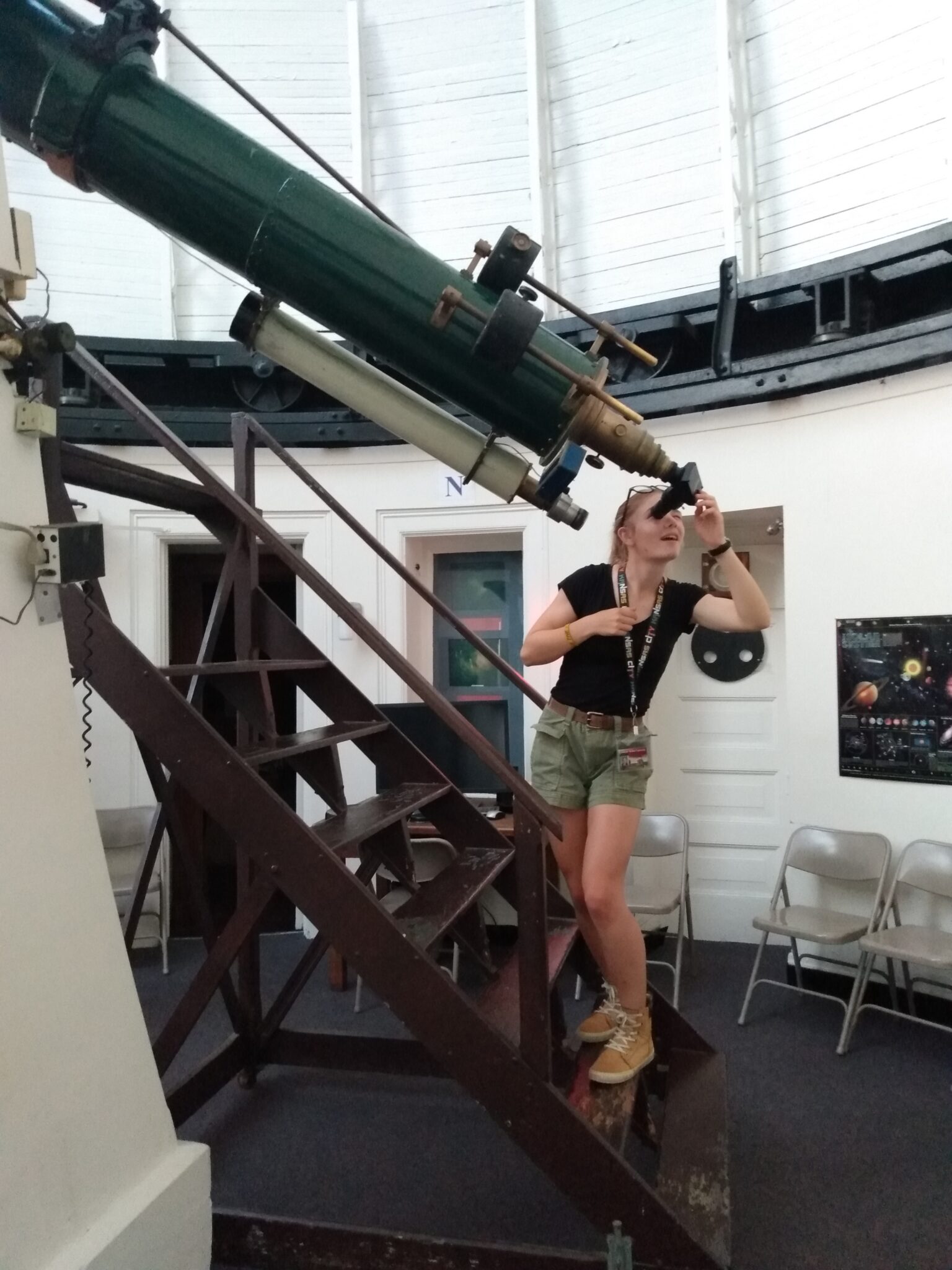 Clair Thomas looking through telescope