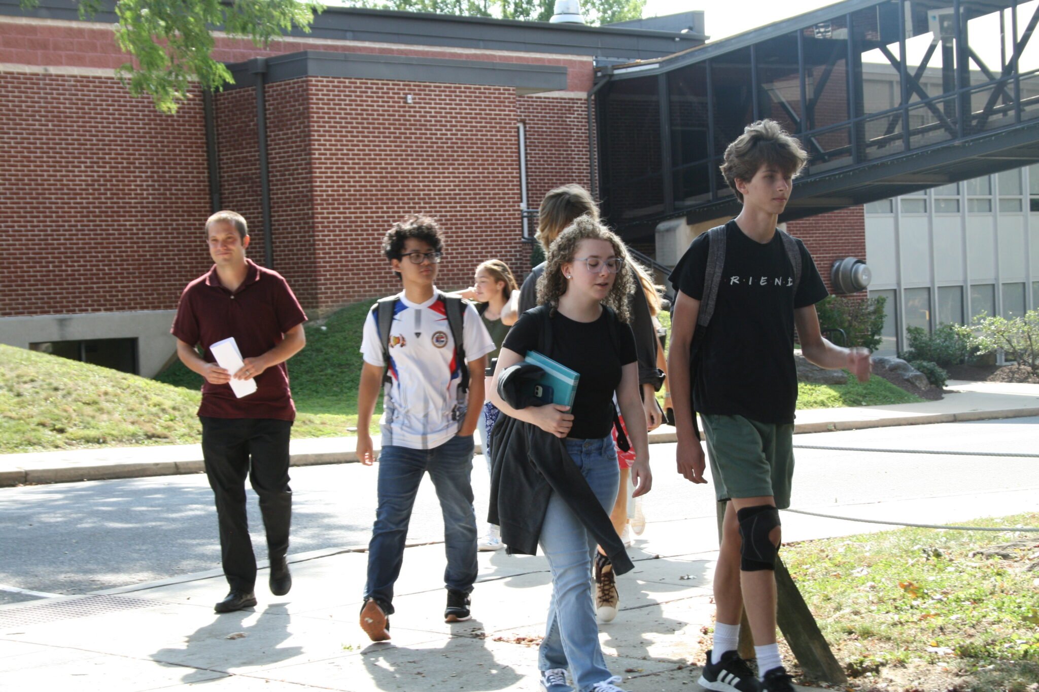 students walking outside between classes
