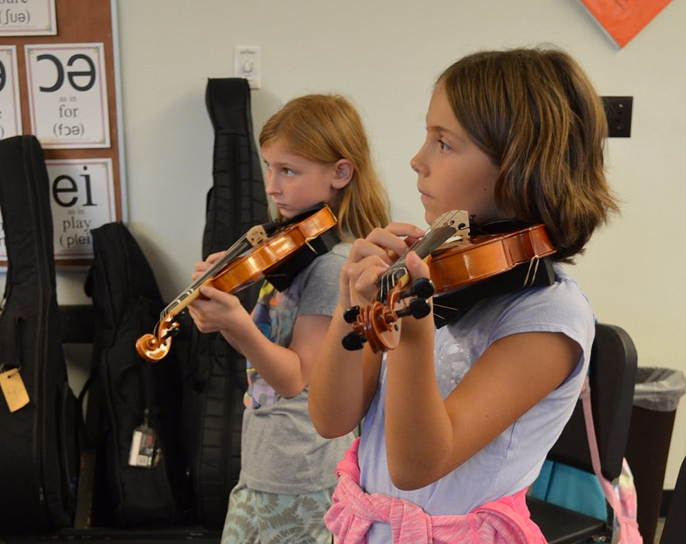 girls playing violin