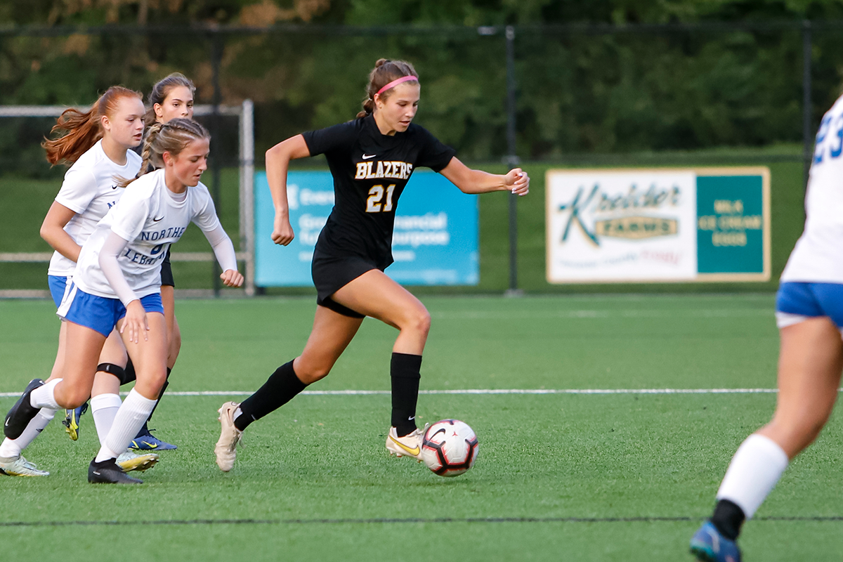 LMH soccer player kicking the ball