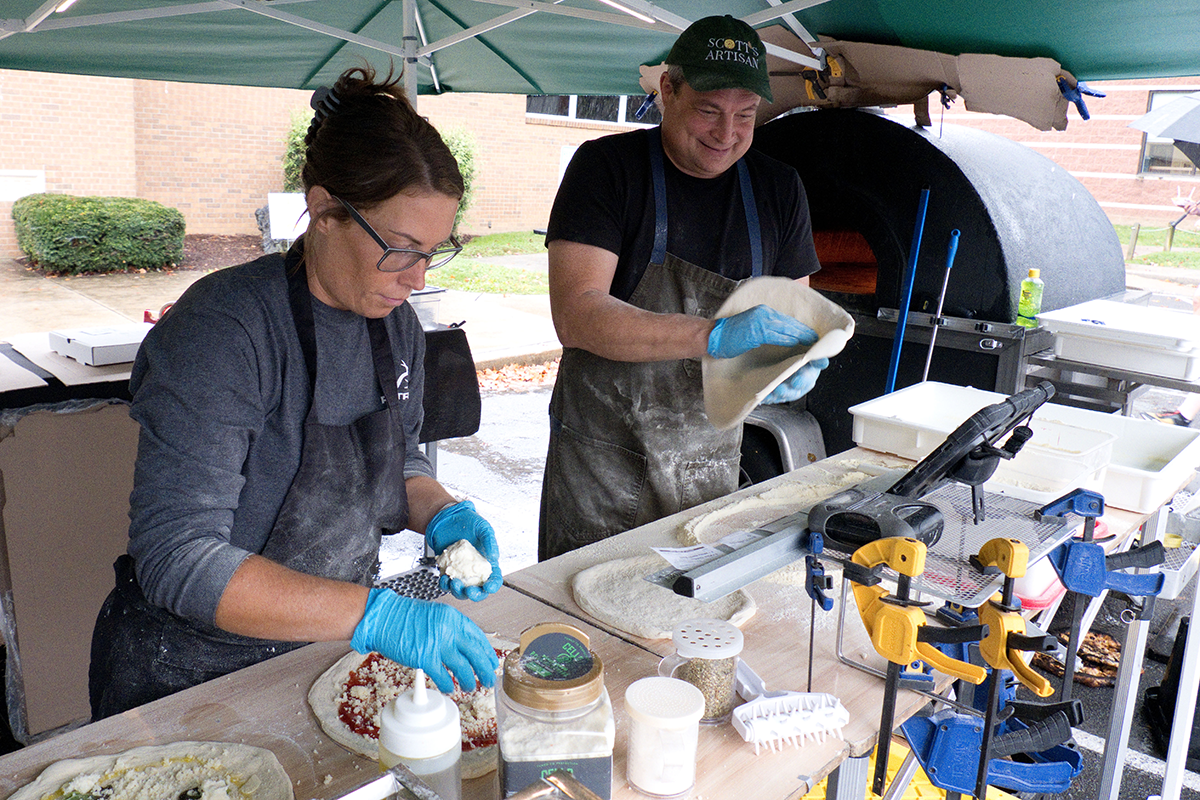 Vendor's preparing pizza during Homecoming