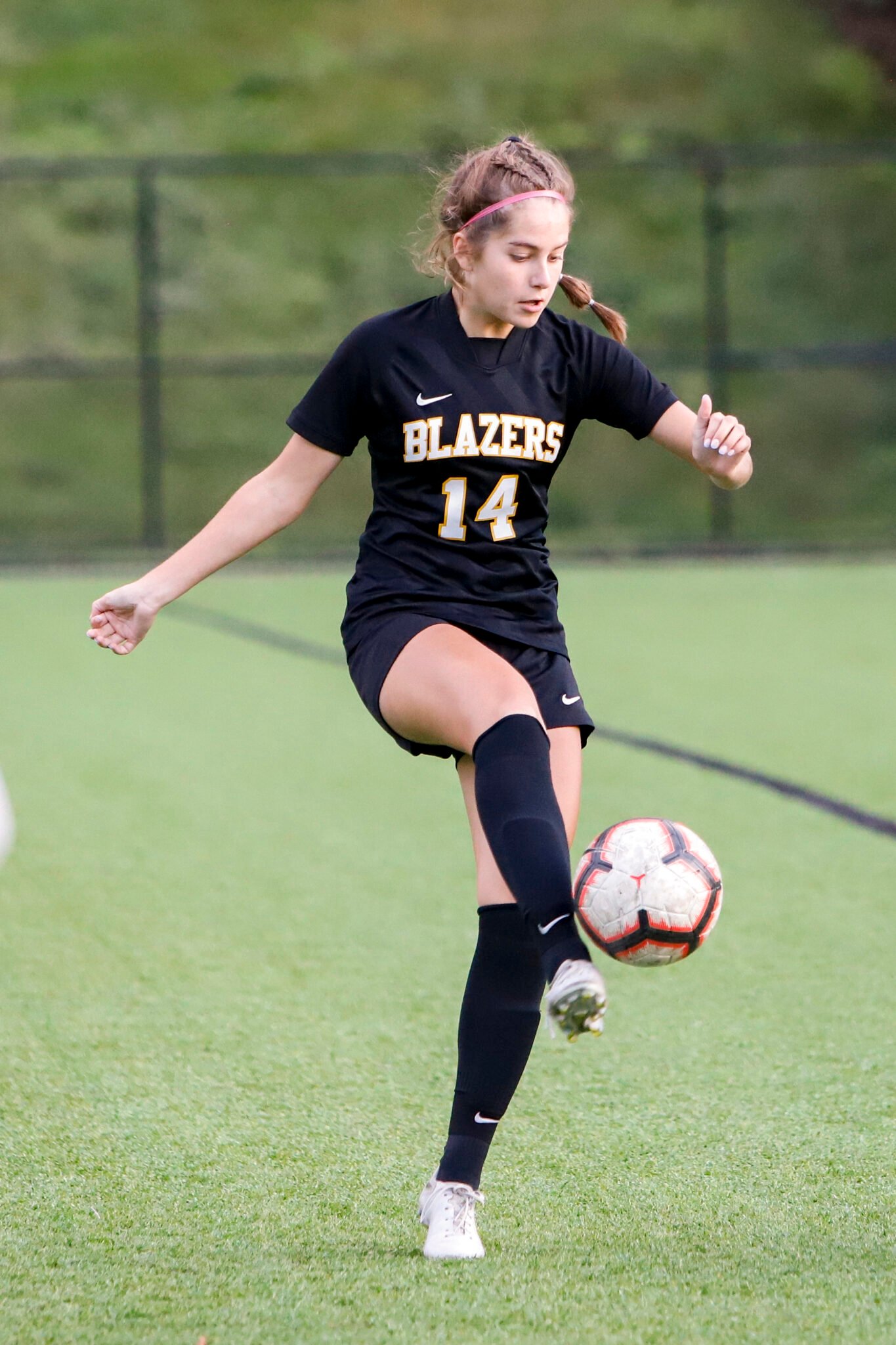 LM girls soccer player kicking the ball